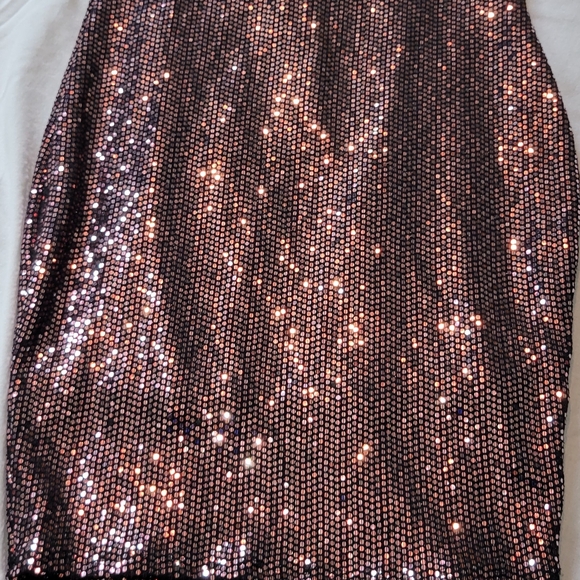 A sparkling mini dress. Open back. - Picture 1 of 4